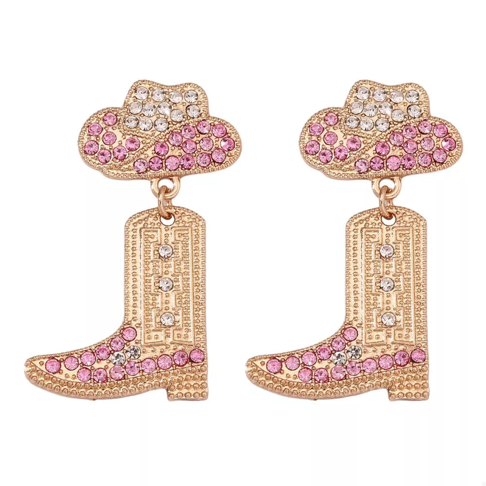 Pink and white rhinestone cowboy boot dangle earrings with gold tone metal.