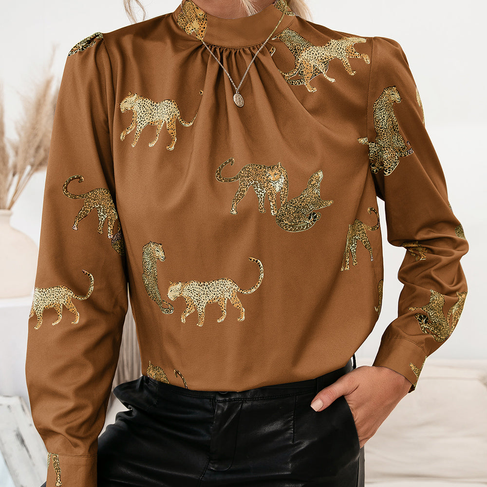 Caramel leopard print keyhole neck blouse with gathered neckline and long sleeves.