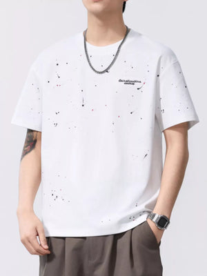 White cotton t-shirt with black and red paint splatter pattern and graphic text.