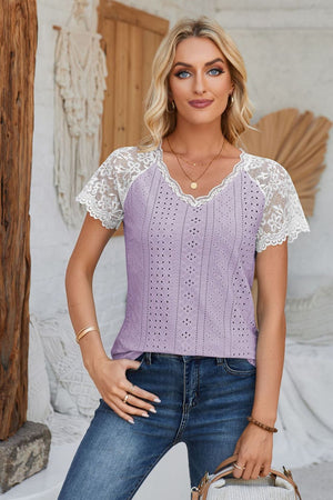 Lavender eyelet raglan blouse with white lace sleeves and v-neckline.