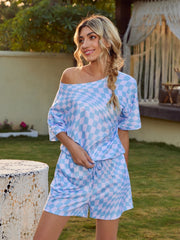 Light blue checkerboard loungewear set with off-the-shoulder top and drawstring shorts.