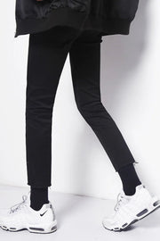 Men's black skinny jeans with raw hem detail