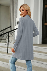 Light blue textured knit open-front duster cardigan with button detail on sleeve