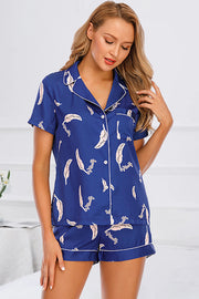 Dark Blue botanical print satin pajama set with button-up top and shorts.