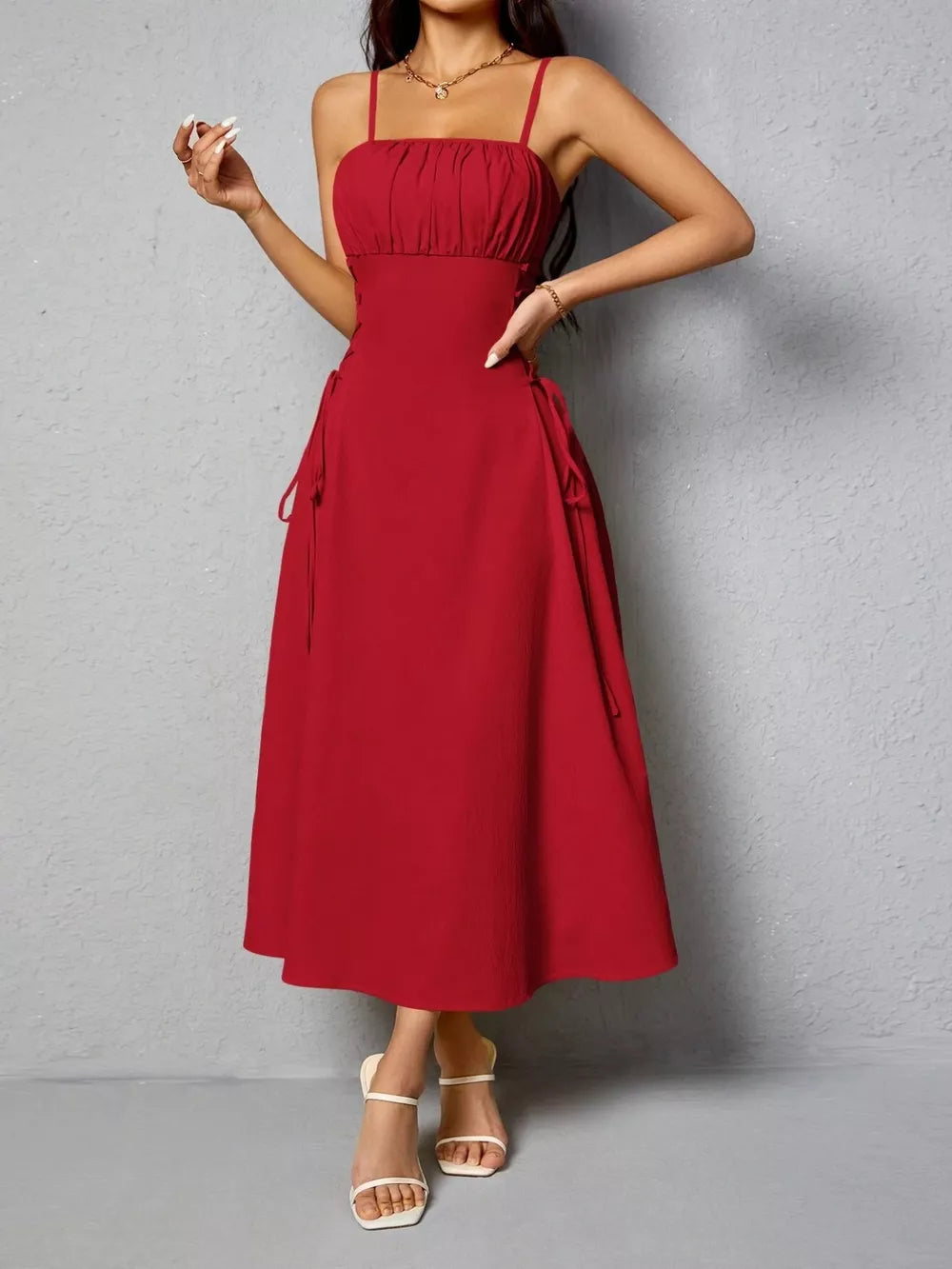 Deep Red cami dress with ruched bodice and crisscross lace-up sides.