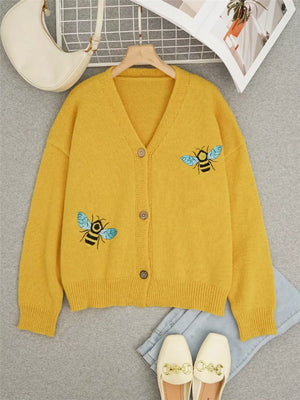 Yellow acrylic V-neck cardigan with bee embroidery, button-down front.