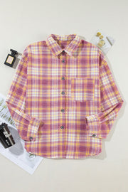 Oversized pink plaid flannel overshirt with button-down front and chest pocket.