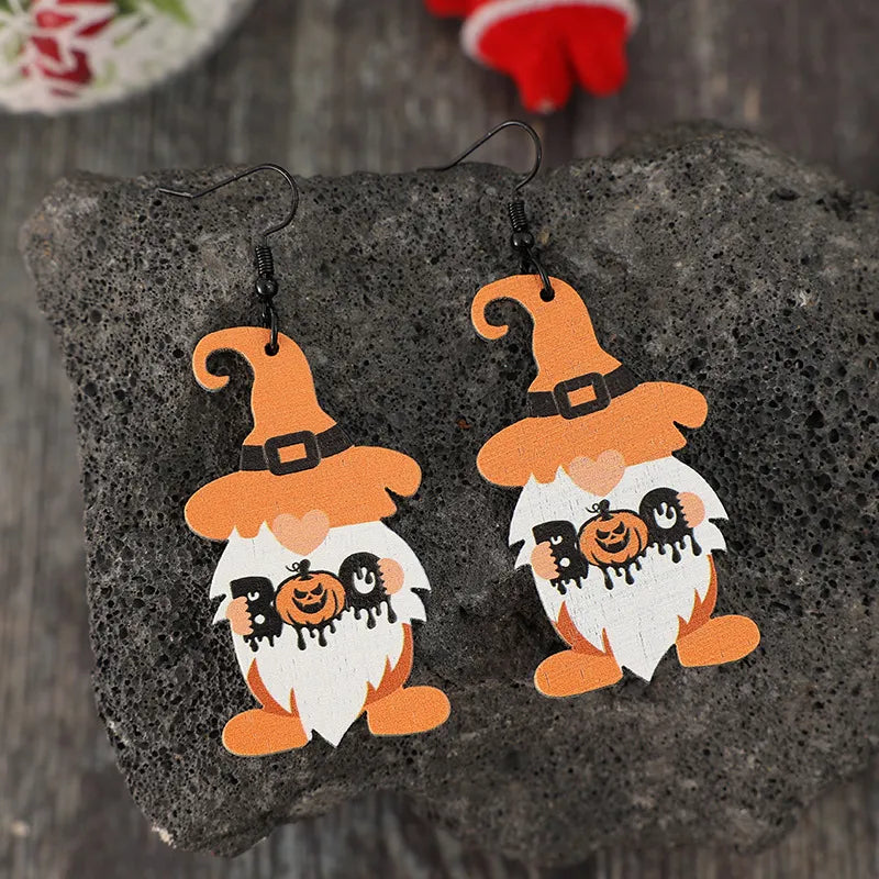 Boo Gnome Halloween earrings in tangerine orange with pumpkin and dripping details.