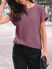 Purple red ribbed knit t-shirt with short sleeves and a crew neck, styled with black jeans.