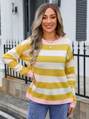 Striped acrylic sweater in yellow and white with pink trim and cuffs.