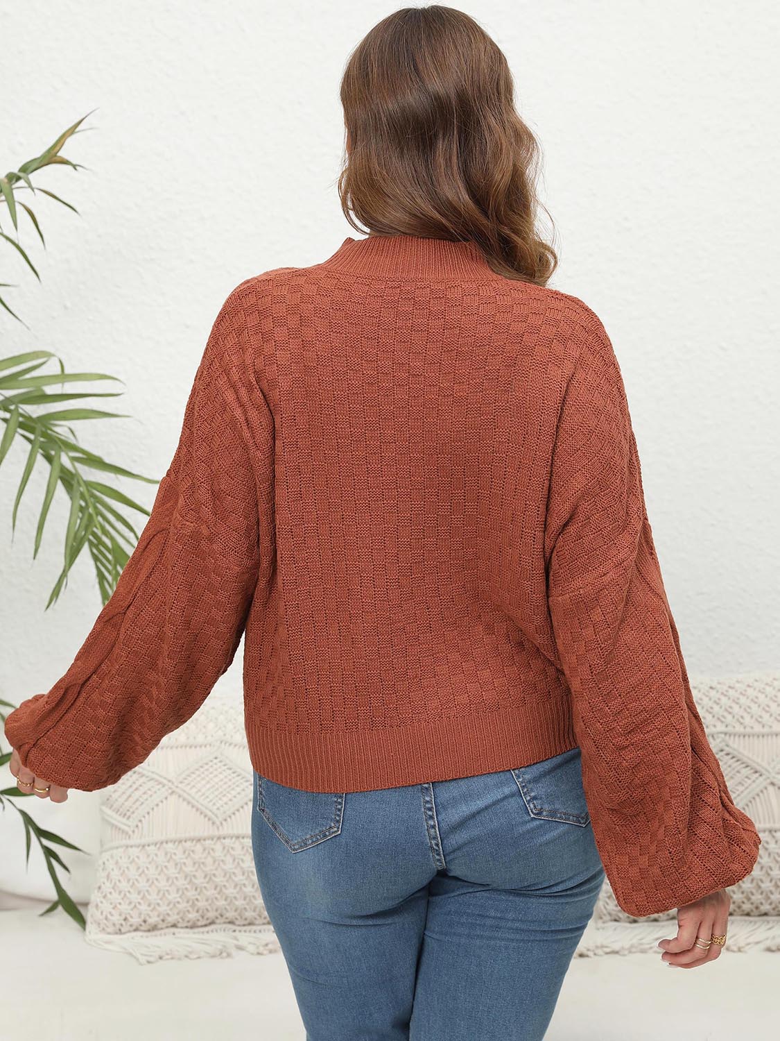 Ochre textured cable knit sweater with balloon sleeves.