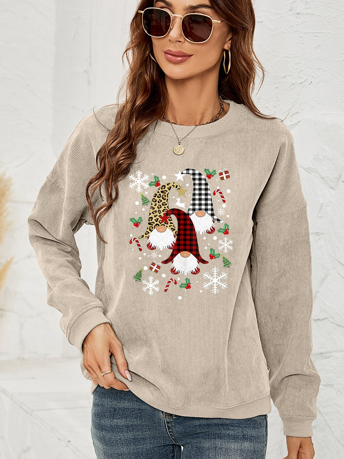 Beige corduroy sweatshirt with a gnome graphic featuring buffalo check, leopard print, and snowflakes.
