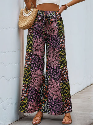 Black floral panel palazzo trousers with tie waist and wide leg