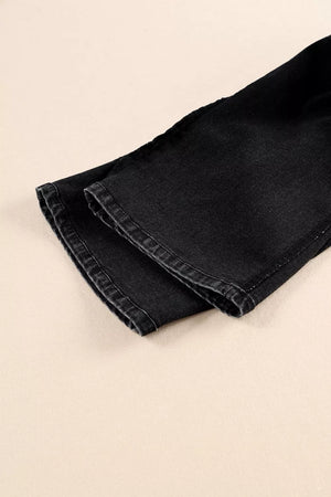 Black denim wide-leg jeans with button fly detail