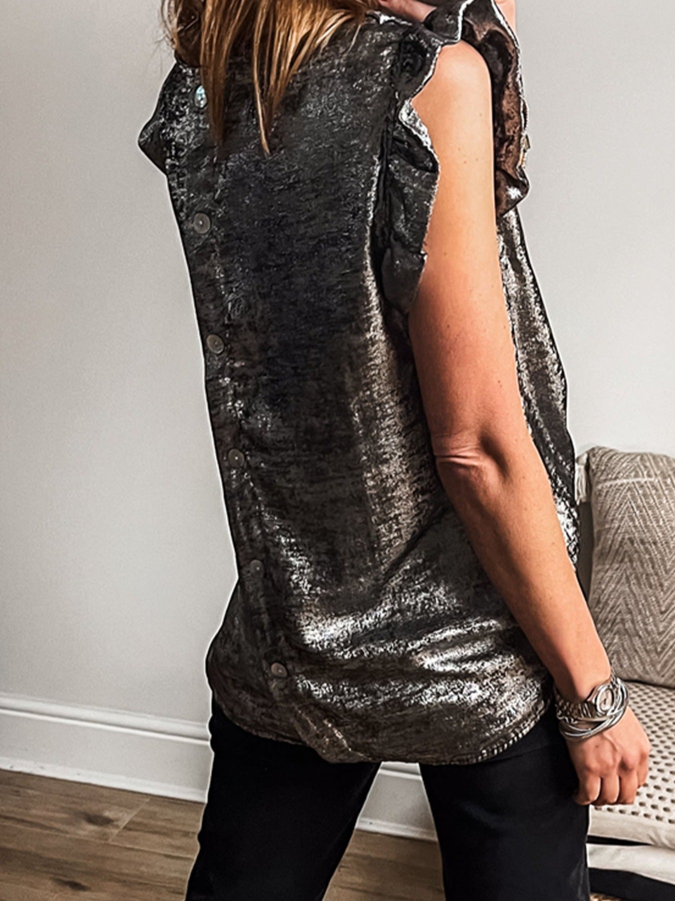 Elegant silver ruffled neck tank top with button back detail.