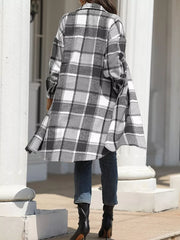 Plaid longline trench coat in grey with button-down front and pockets.