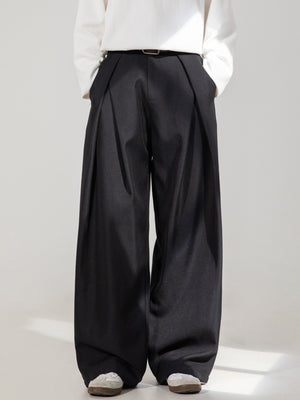 Men's black wide-leg trousers with pleats and a belt.
