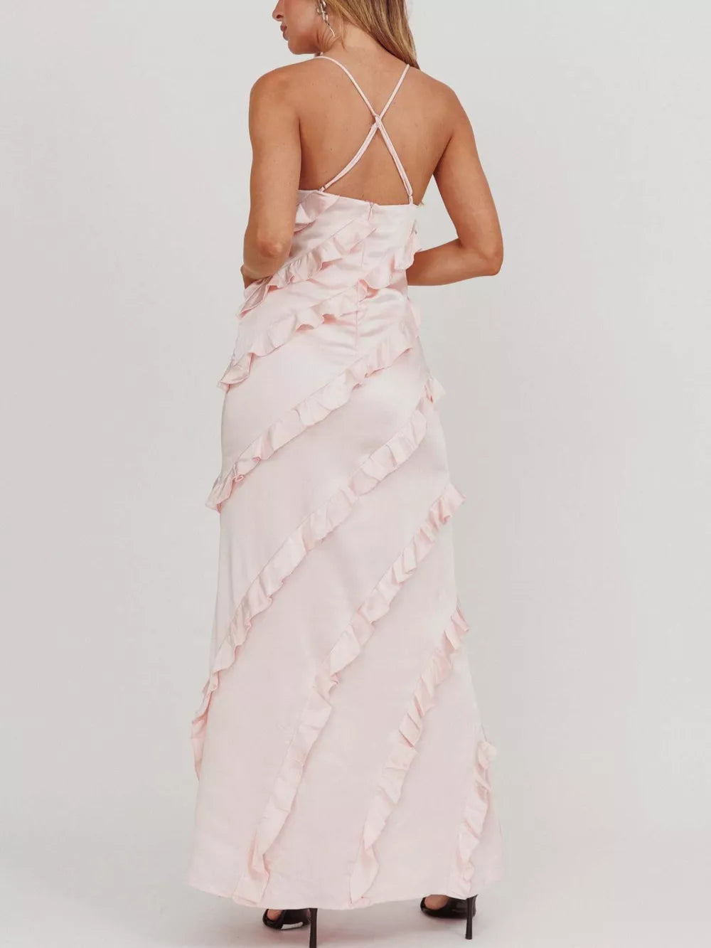 Blush pink ruffled spaghetti strap maxi dress with diagonal ruffle detailing.