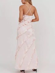 Blush pink ruffled spaghetti strap maxi dress with diagonal ruffle detailing.