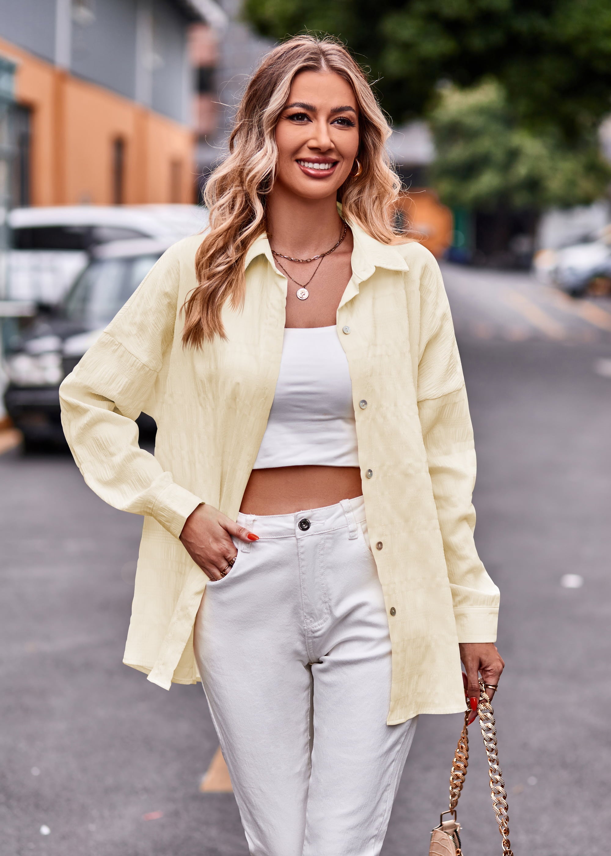 Textured overshirt in ivory with relaxed fit, buttoned front, and long sleeves.