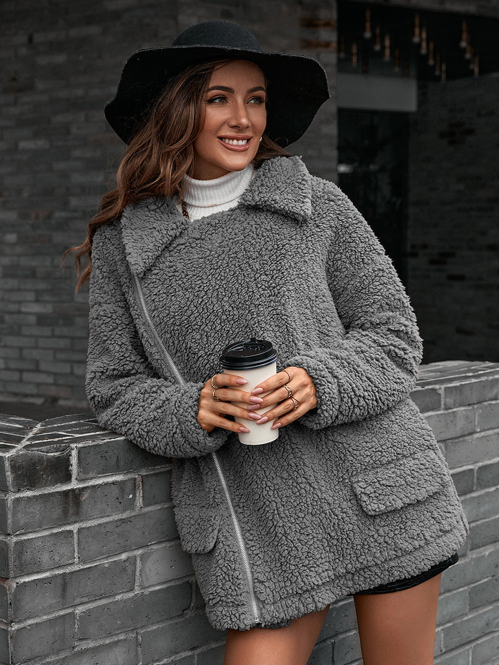 Gray teddy moto jacket with asymmetrical zip and pockets, collared, cozy fleece.
