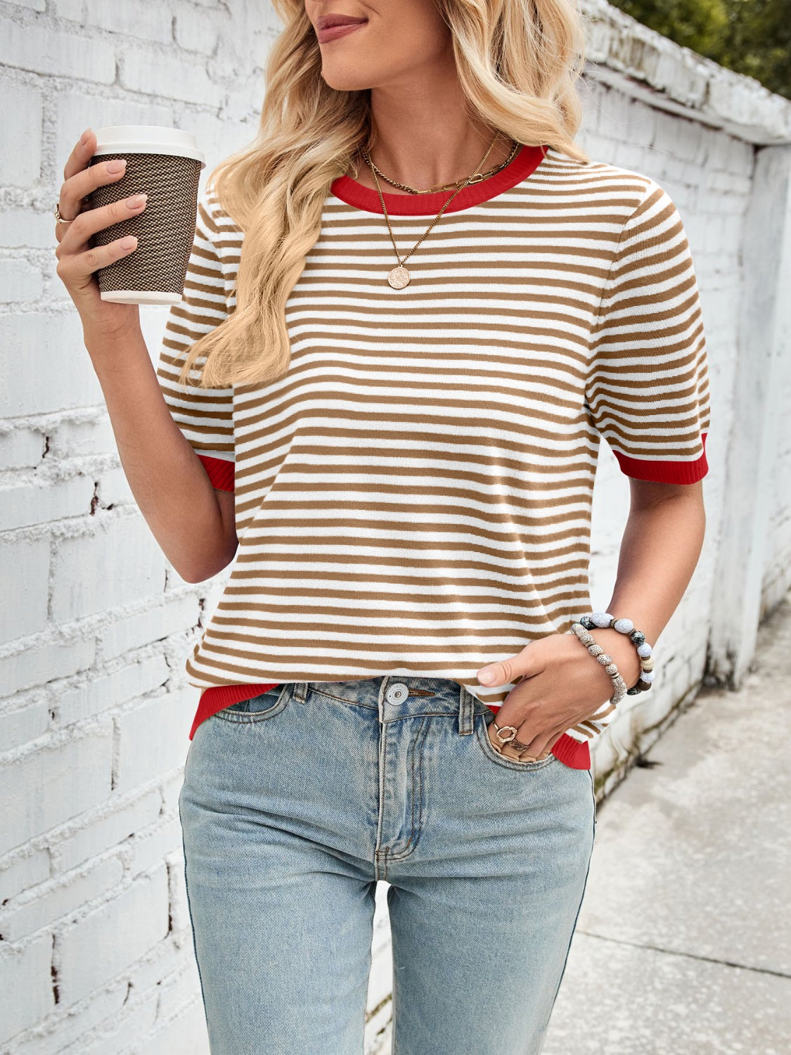 Striped knit tee with red trim and short sleeves.
