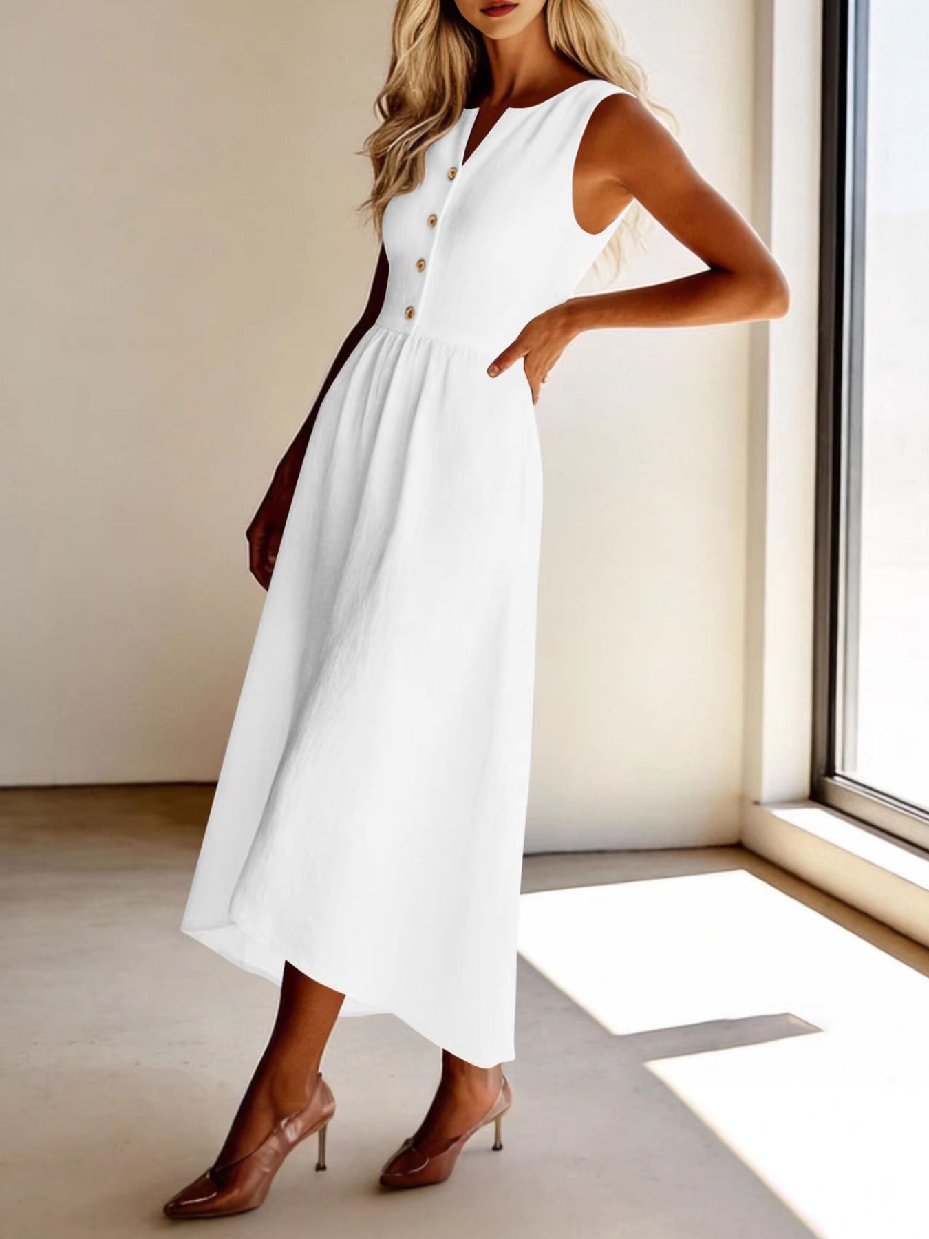 White sleeveless button front midi dress with a-line skirt.