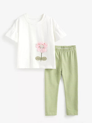 Toddler white cotton t-shirt with pink floral applique and green striped leggings.