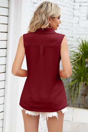 Burgundy collared sleeveless top with pleat detail on back yoke