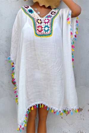 White kaftan dress with colorful crochet yoke and tassel trim