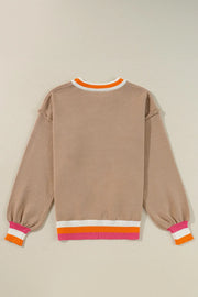 Dust Storm knit sweater with balloon sleeves and colorblock trim at neckline and hem.