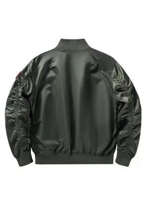 Bomber jacket in Moss green with ruched sleeves and ribbed collar, cuffs, and hem.