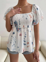 Smocked square neck blouse with flutter sleeves and a floral print.