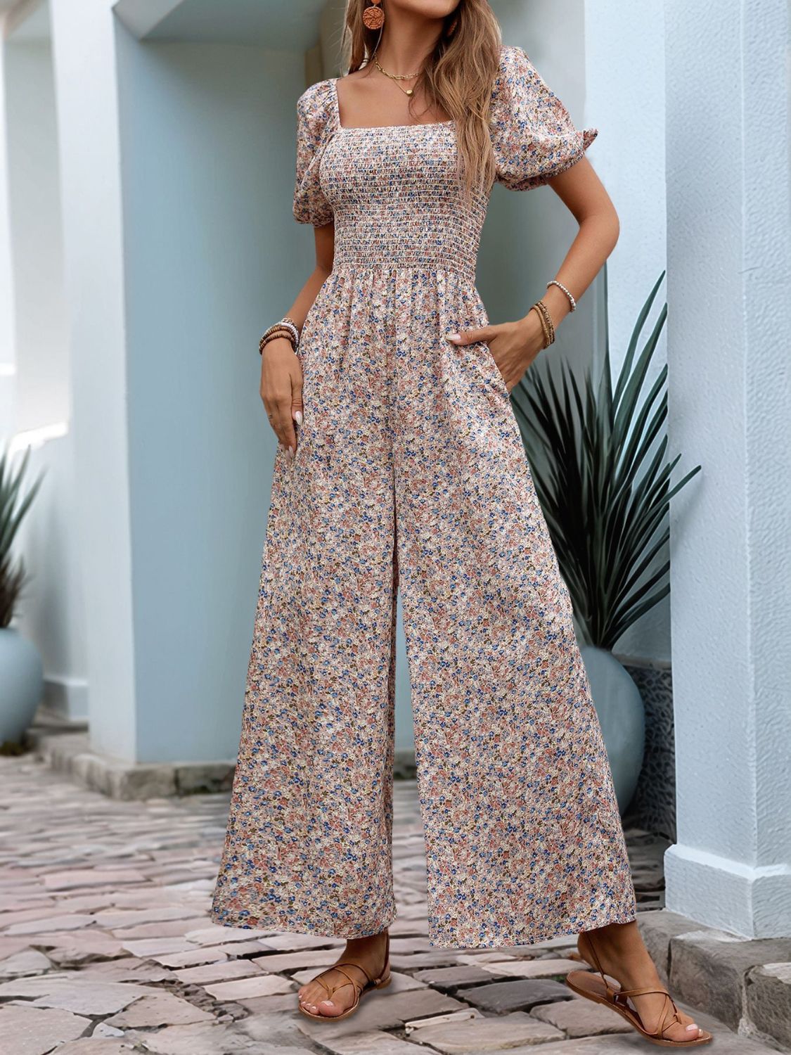 Floral smocked bodice wide leg jumpsuit with puff sleeves and square neckline