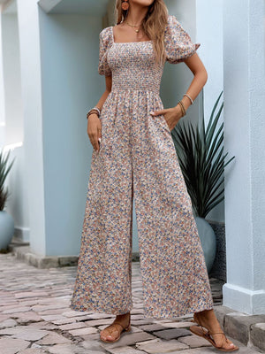 Floral smocked bodice wide leg jumpsuit with puff sleeves and square neckline