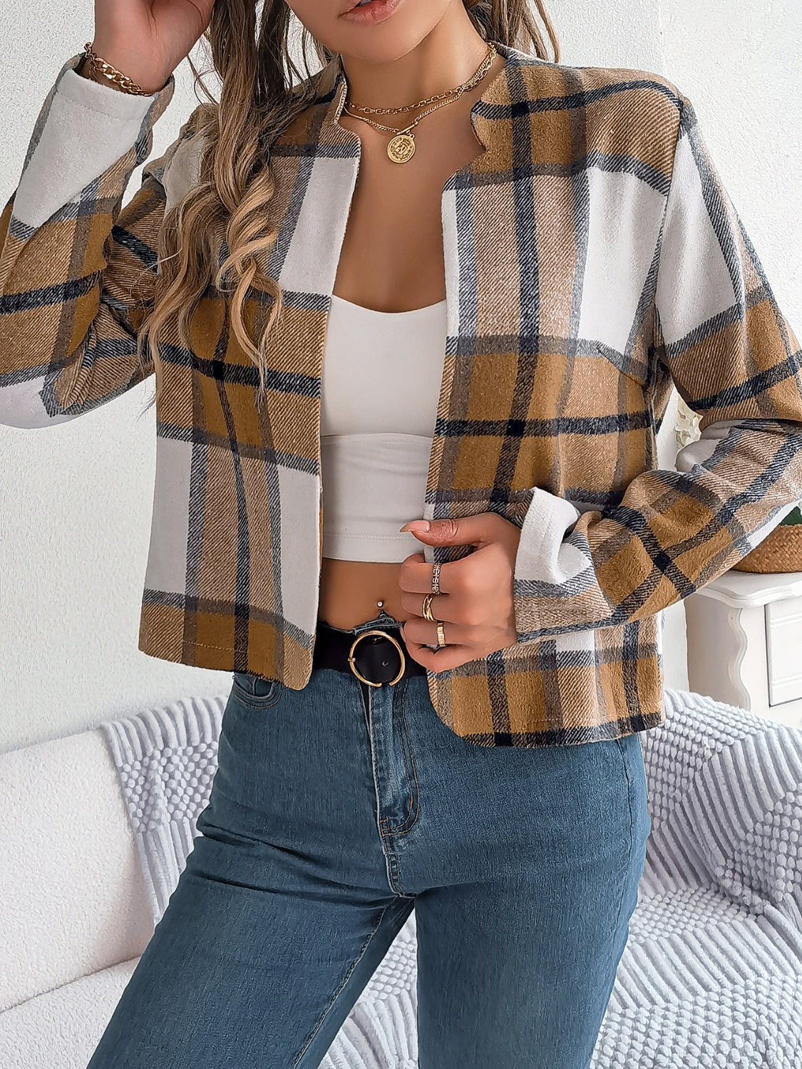 Collarless plaid cropped jacket in camel, white, and dark blue with a relaxed fit.