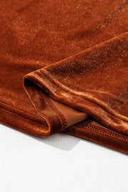 Brown velvet blouse with subtle shimmer and gathered detail.