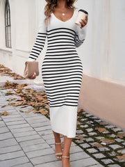 Striped knit midi dress in black and white with flared sleeves and a v-neck.