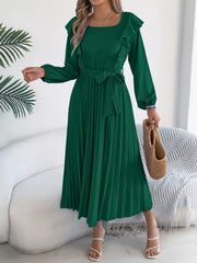 Green ruffled A-line midi dress with long sleeves, square neckline, and pleated skirt.