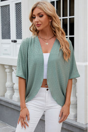 Light green open-front kimono top with crochet detail and short sleeves.