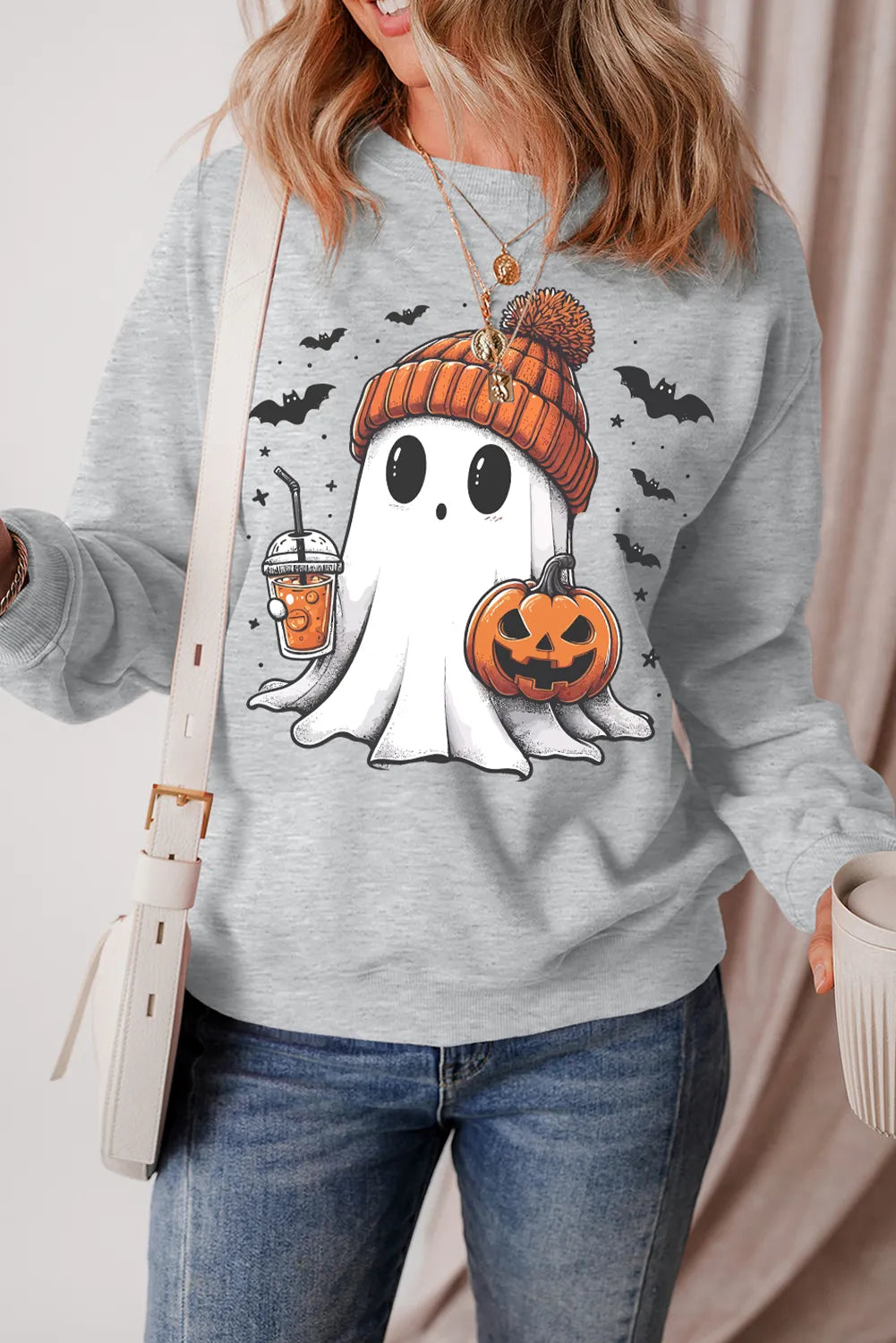 Gray crewneck sweatshirt with a cute ghost graphic, pumpkin, and bats.