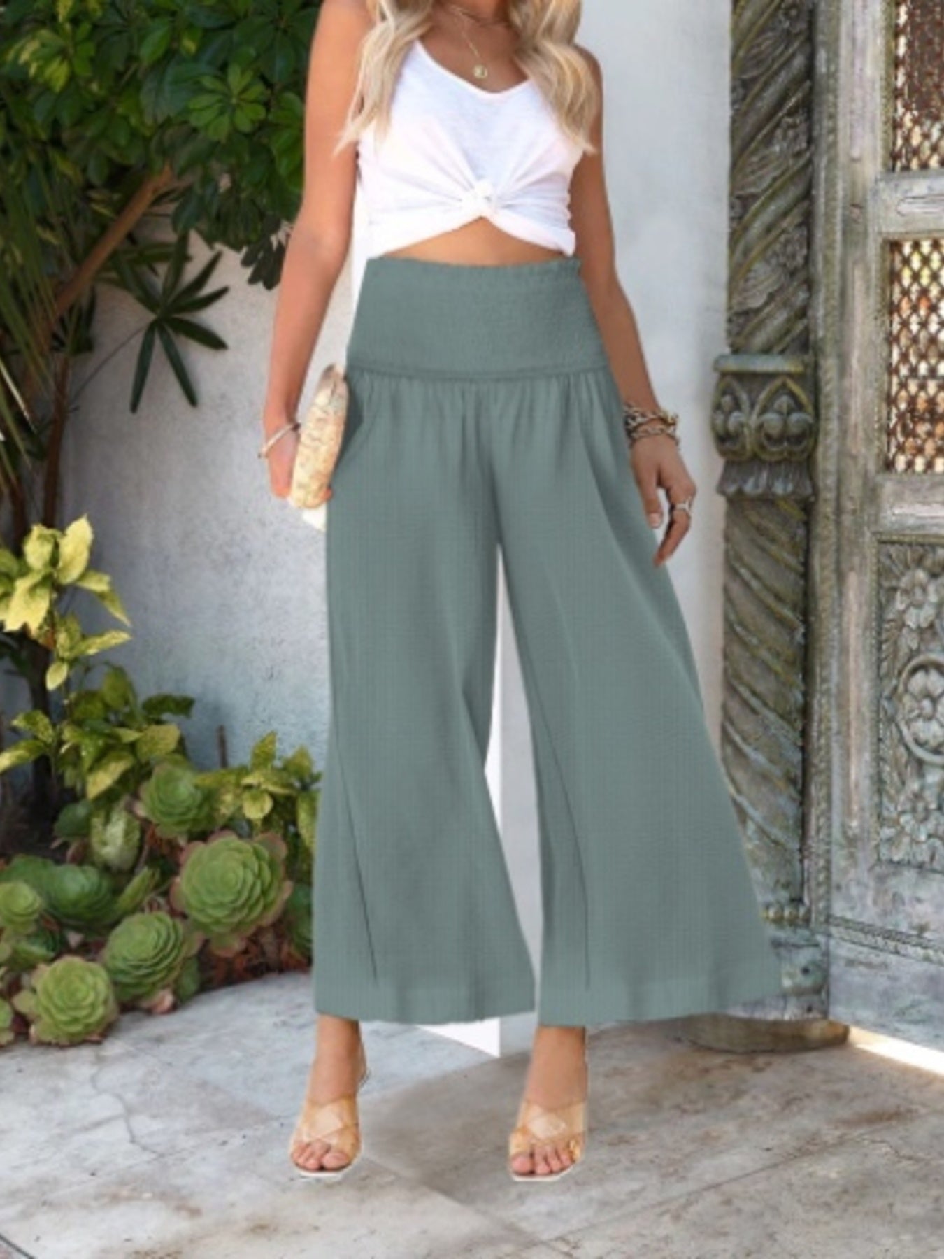 Smocked waist wide-leg trousers in light green, ankle length, casual style.