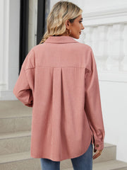Pink corduroy overshirt with patch pockets and a back pleat detail.