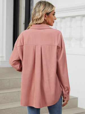 Pink corduroy overshirt with patch pockets and a back pleat detail.