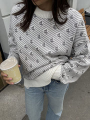 Light Gray Sailboat Jacquard Knit Sweater with crewneck and ribbed cuffs.