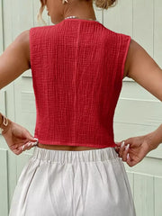 Red textured cotton cropped button vest with a crinkled finish.
