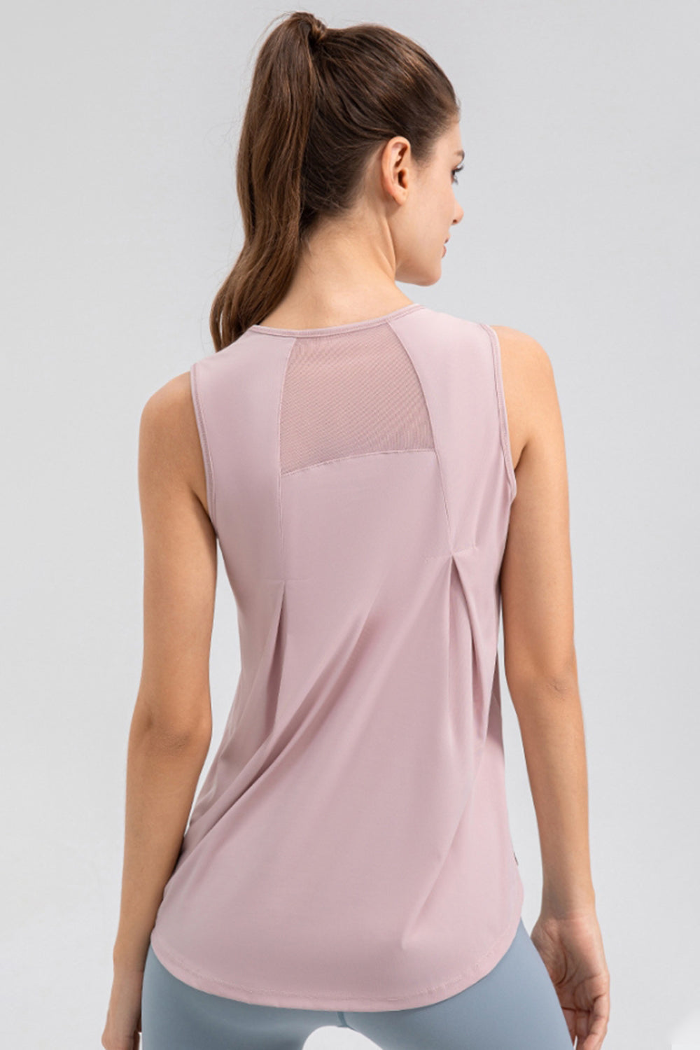 Dusty Pink mesh panel performance tank top with pleat detail on back.