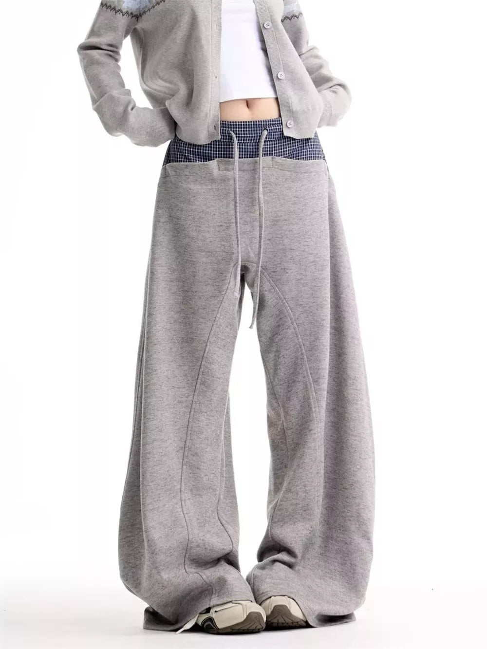 Grey wide-leg sweatpants with drawstring and plaid waistband detail