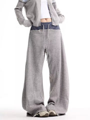 Grey wide-leg sweatpants with drawstring and plaid waistband detail