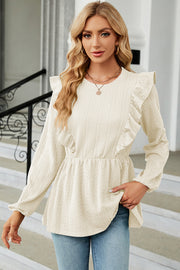 Cream textured peplum blouse with ruffle detail and long sleeves